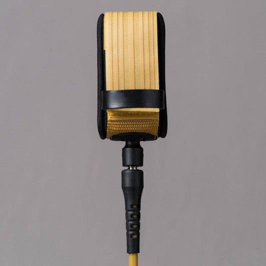 Back view of Deflow 9ft 7mm knee leash in mustard with reinforced strap.