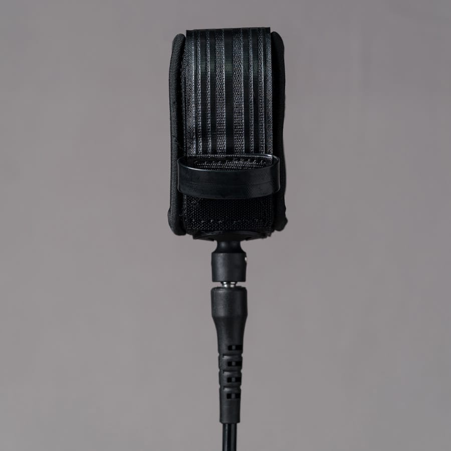 Back view of Deflow 9ft 7mm black knee leash with secure strap design.