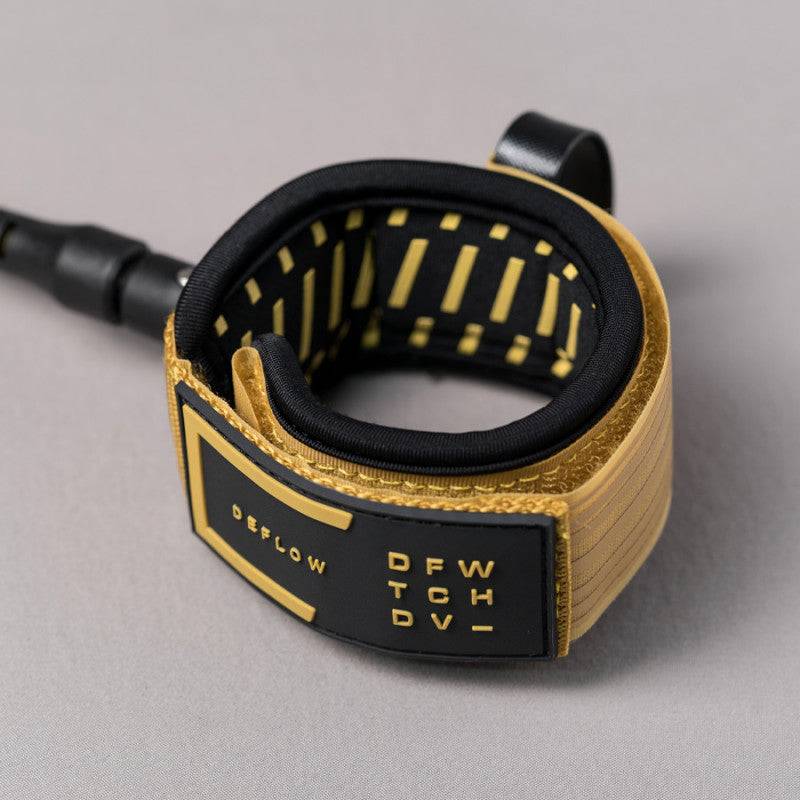 Coiled Deflow 9ft 7mm knee leash in mustard with premium materials.
