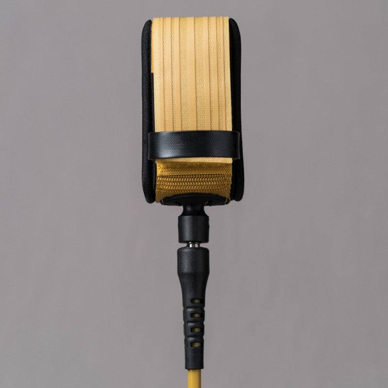 Back view of Deflow 9ft 7mm knee leash in mustard with reinforced strap.
