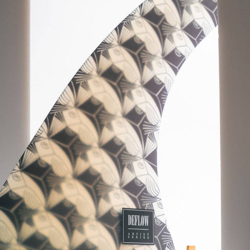 Deflow JDF COLLAB single fin with branding and stylish pattern, illuminated.